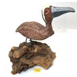Carved Bird on driftwood