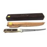 Schrade Uncle Henry stag handle knife in leather