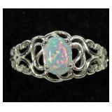 Sterling silver prong set lab fire opal ring in
