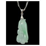Carved jade fish pendant with 20" sterling figaro