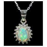 Sterling silver oval cabochon opal pendant with CZ