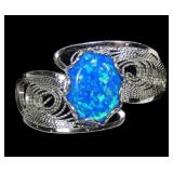Sterling silver lab blue opal ring in lacy bypass