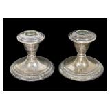 Pair of sterling silver weighted candle sticks,