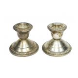 Pair of sterling silver weighted candle sticks,