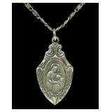 Sterling silver double sided religious medal with