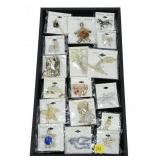 Lot, fashion pins and brooches, new in packaging