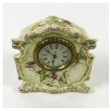 Ansonia wind up clock in porcelain case 5 1/2'