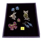 Lot, bejeweled brooches and earrings, including