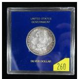 1883 Morgan dollar in U.S. Government holder, BU