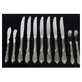 Set of 11 Sterling handle knives, 5.5 T. oz t.w.,