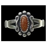 Sterling silver dentil set goldstone ring in split