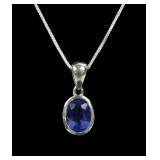 Sterling silver oval cut bezel set blue sapphire