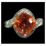 Sterling silver prong set cushion cut orange stone