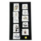 Lot, fashion pins and brooches, new in packaging