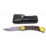Buck 110 Folding knife with leather sheath