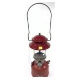 Coleman Model 200A red lantern with glass globe