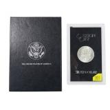1884-CC GSA Morgan dollar with box and paper,
