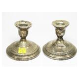 Pair of sterling silver weighted candlesticks,