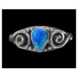 Sterling silver bezel set lab blue opal in scroll