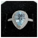 Sterling silver pear cut prong set blue topaz ring
