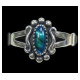 Sterling silver dentil set blue paua ring with