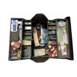 Vintage metal tackle box with contents including