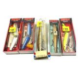 Lot, 4 Rapala lures in packages and 1 Rebel lure
