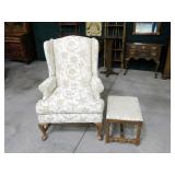 Upholstered wingback chair with footstool
