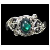 Sterling silver blue paua ring in lattice setting,