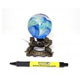Signed art glass paper weight, with brass stand