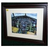 Framed and matted cockpit print,