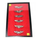 Collection of Air Corps wings in riker mount,