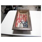 Shadow box with U.S. Insignia, pins, photo, flag