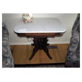 Marble top table with carved walnut base,