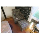 Plaid upholstered armchair with ottoman, clean