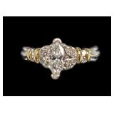 Platinum and 18K gold marquise cut diamond ring,