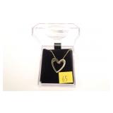 Sterling silver heart pendant with diamond accents