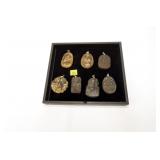 Lot, 7 carved stone pendants