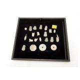 Lot, 21 carved light green stone pendants