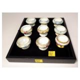 Set of nine Austrian porcelain hand painted salts