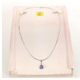 14K White gold bezel set triangular tanzanite