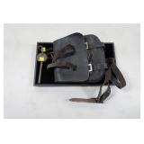 Black leather pouch with straps and loading tool