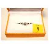10K White gold bezel set modified round brilliant