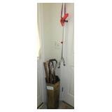 Brass umbrella stand with assorted canes and