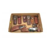 Lot, assorted pocket knives in leather cases: