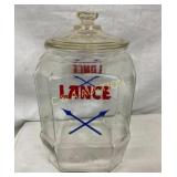LANCE STORE JAR W/ CROSS ARROWS AND LID 7X12 1/2