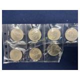 Set of Seven Eisenhower Dollar Coins in Protective