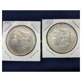 Two Morgan Silver Dollars, 1883-O and 1889, in Pro