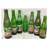 6 Mountain Dew Bottles and 1 7-Up