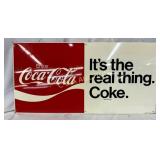 Metal Coca-Cola Sign Featuring 'It's the Real Thin